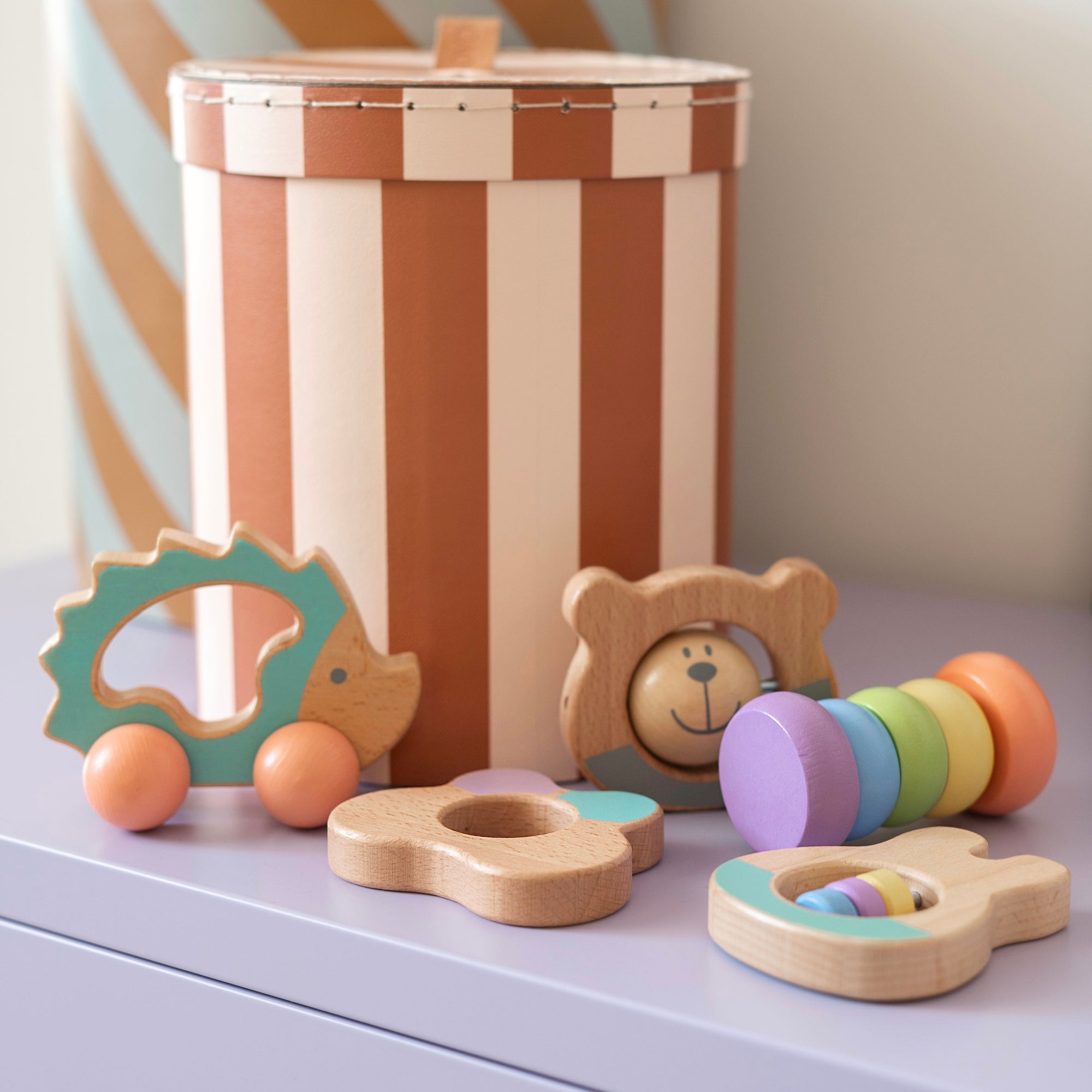 Image shows colourful wooden rattle set.