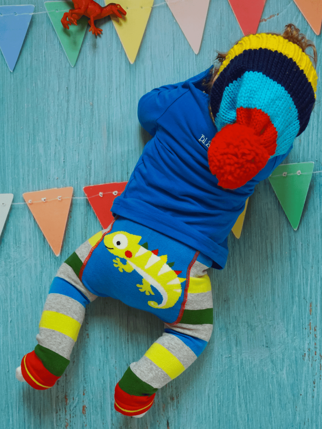 Image shows cute baby leggings with chameleon design on the bum.